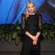 Emma Roberts in a black dress.